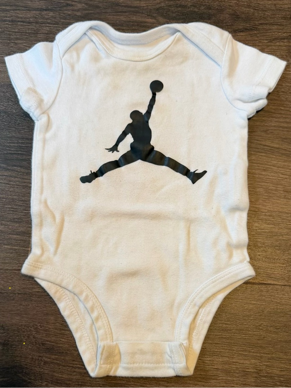 Jordan White Baby One-Piece with Black Jumpman Silhouette